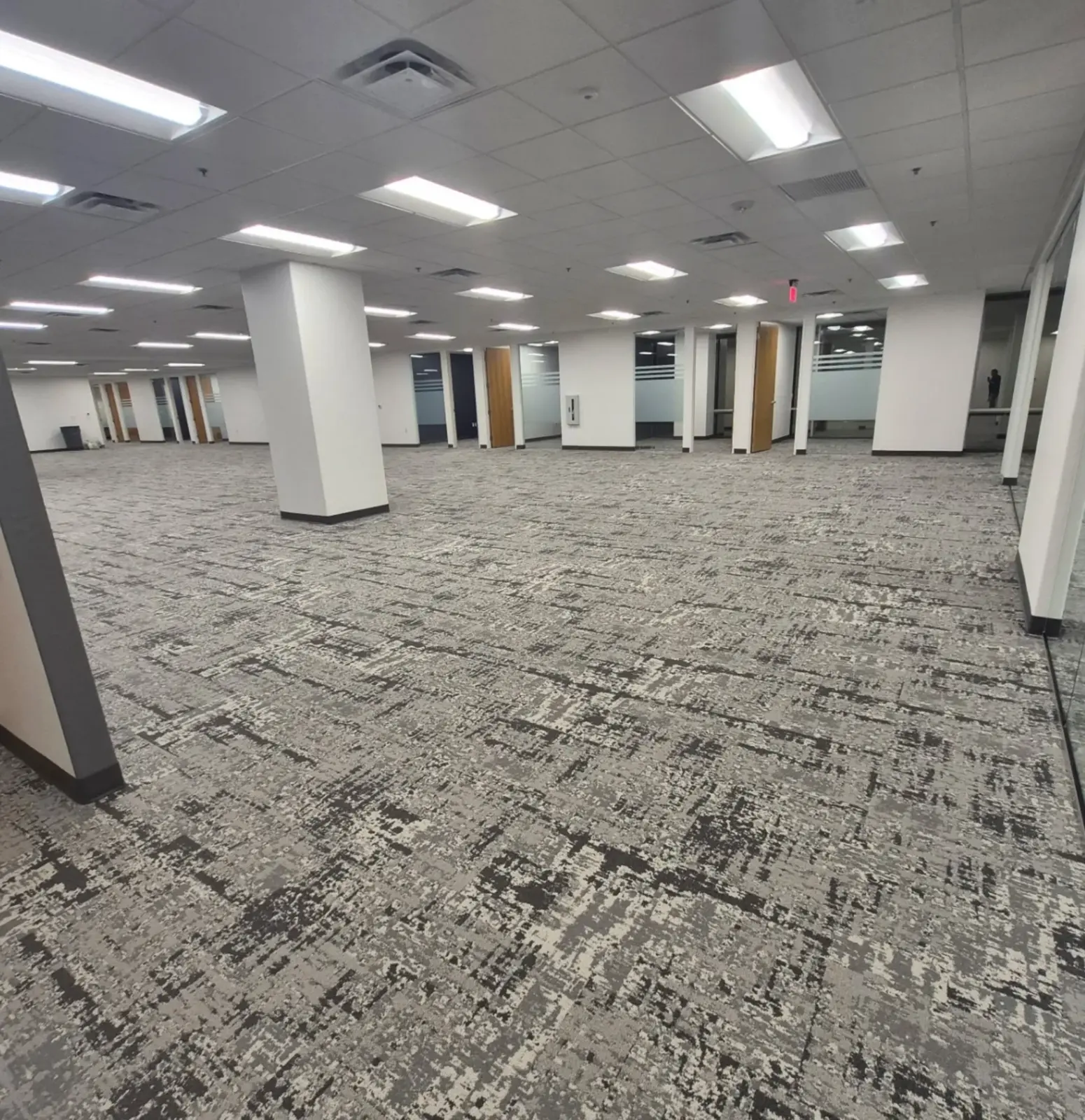 Cleaned open commercial office space with carpeted floor